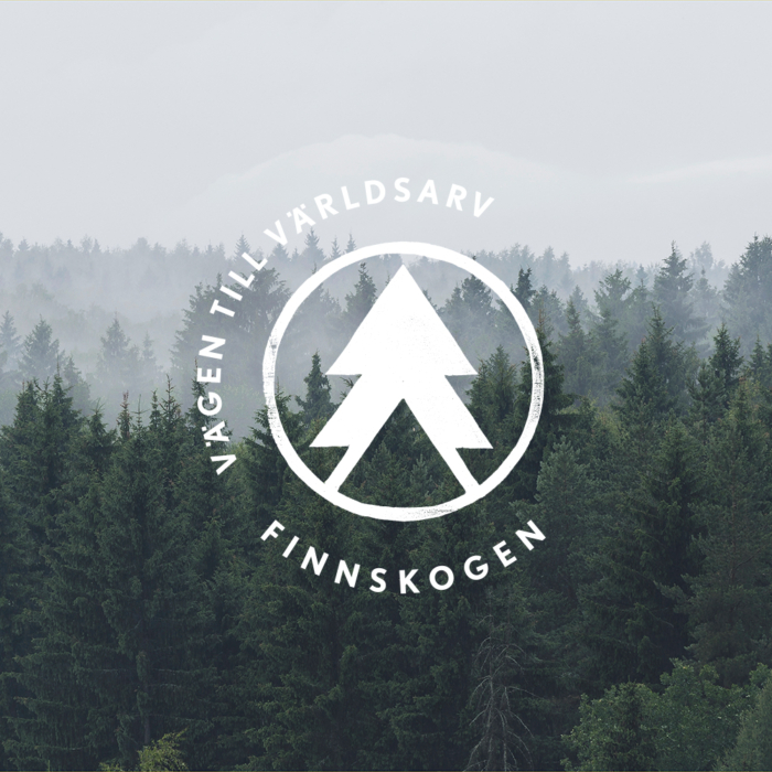 Finnskogen – vägen till världsarv, logotyp