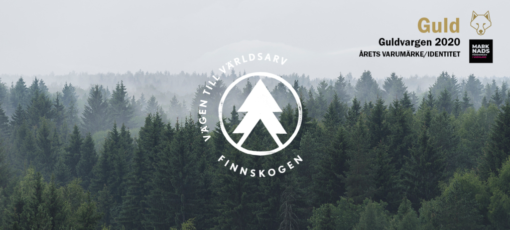 Finnskogen – vägen till världsarv logotyp mot skog